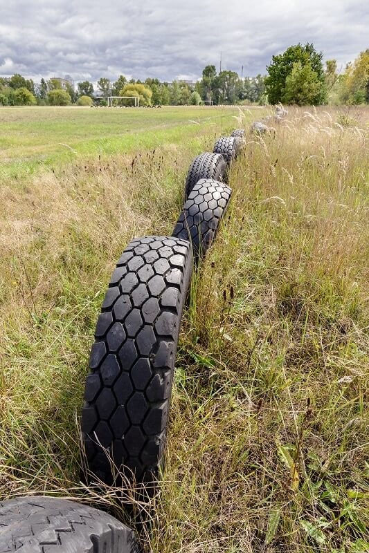 reusing old tires for athletic fields